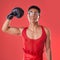 Portrait, boxing and gay man with gloves for a fight isolated on a red background in a studio. Strong, fitness and lgbt