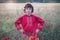 Portrait of a boy in a field with wild flowers.