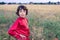 Portrait of a boy in a field with wild flowers.