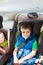 Portrait of boy listening to music in a car trip