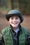 Portrait of boy in panama in forest