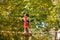 Portrait of the boy on rope suspended tree bridge