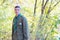 Portrait of Boy Scout in Forest on Sunny Day