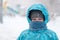 Portrait of a boy during a snowstorm