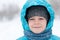 Portrait of a boy during a snowstorm