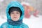 Portrait of a boy during a snowstorm