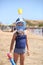 Portrait of a brave caucasian girl at the seaside wearing diving mask