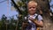 Portrait of a brave little boy in a rope Park in the summer.