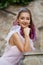 Portrait of a bride with purple hair close-up. A woman in a beautiful dress is resting.