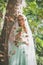 Portrait of bride with veil and bouquet of wild flowers outdoor