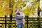 Portrait of brother and baby sister with a colorful yellow leaves