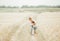 Portrait of brother and little sister together on summer wheat field