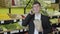 Portrait of brunette brown-eyed Caucasian man talking on the phone in grocery. Adult confident guy holding pack with