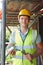 Portrait Of Builder Putting Up Scaffolding