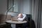 Portrait of business blonde, white caucasian man person sleeping, resting, napping on table to sleep and relax with computer