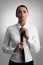 Portrait, business and woman adjust tie in studio  on a gray background. Face, confidence and professional