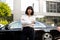 Portrait of business woman in front of a luxury car outdoors