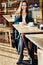 Portrait of a business woman with office tools sitting with while having a cup of coffee