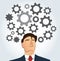 Portrait of businessman with gears icon background