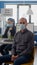 Portrait of businessman sitting at office desk wearing medical face mask