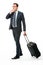 Portrait of a businessman with suitcase stopping a taxi