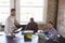 Portrait Of Businessmen Working Together In Boardroom