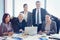 Portrait of businesspeople smiling in conference room