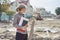 Portrait of businesswoman on construction site repairing road