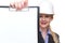 Portrait of a businesswoman in hardhat holding clipboard