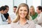 Portrait Of Businesswoman Sitting At Boardroom Table