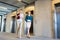 Portrait of businesswomen walking out from elevator in office