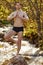 Portrait of calm caucasian male standing on rock meditating