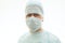 Portrait of calm surgeon in sterile gown and surgical mask