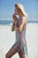 Portrait of a calm woman taking a sunbath on a summer beach