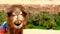 Portrait of a camel resting close to a palm forest in a Tinerhir village near Georges Todra, Morocco