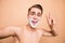 Portrait of carefree, careless, rejoice man in foam for shave on