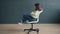 Portrait of carefree lady spinning on chair in studio enjoying funny activity having fun