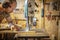 Portrait of a carpenter inside his carpentry workshop using a band saw