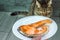 Portrait of a cat with fried fish. Natural pet food concept