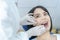 Portrait of Caucasian beautiful girl patient smiling and waiting for treatment from professional dentist for oral care check up