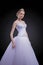 Portrait of Caucasian Bride Posing in Gorgeous Wedding Dress Mad