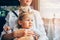 Portrait of caucasian child sitting on mom lap in public transport bus