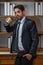 Portrait of caucasian executive businesman in business suit holding coffee cup