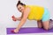 Portrait caucasian fat overweight obese woman on fitness mat, smiling, gesture thumb up stand exercise with dumbells for