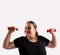 Portrait of caucasian fat, overweight, obese woman, looking to camera with smile, exercises with red dumbells for fit