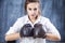 Portrait of Caucasian Female Boxer Posing in Brown Leather Boxer Gloves