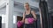 Portrait of caucasian female boxer wearing boxing gloves at the gym