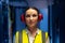 Portrait of caucasian female engineer wearing ear plugs in computer server room