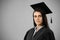 Portrait of a Caucasian female student holding a certificate graduating