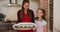 Portrait of caucasian mother and daughter standing in the kitchen